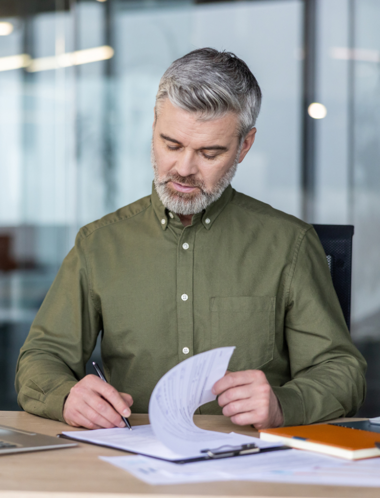 Mature man reviewing legal papers